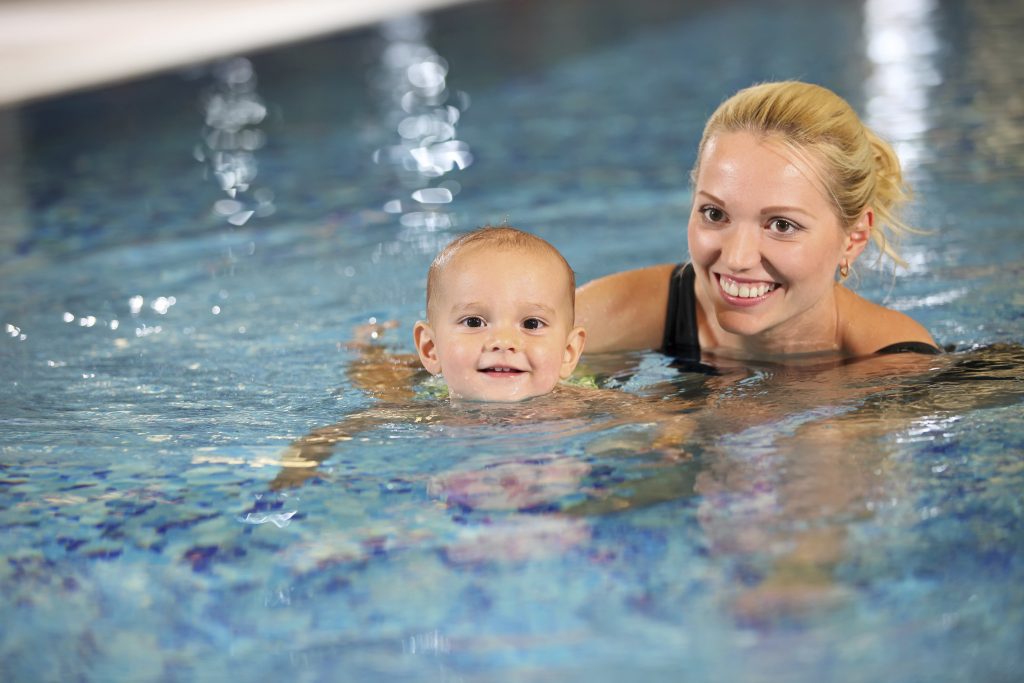 Mother and child swimming