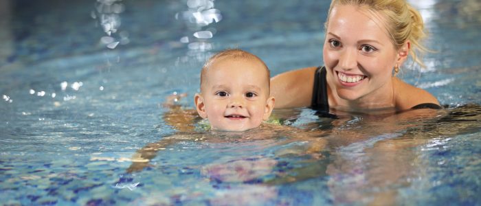 Mother and child swimming