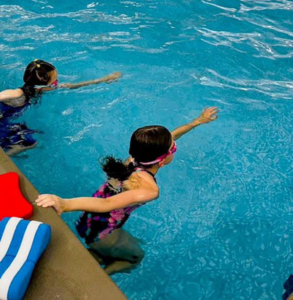 Two adults in the pool